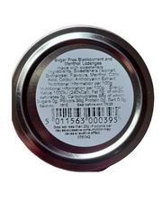 The bottom circular lid of a tin of sugar free frog in your throat, showing printed product information including ingredients, nutritional facts, and a barcode on a dark reddish-brown surface.